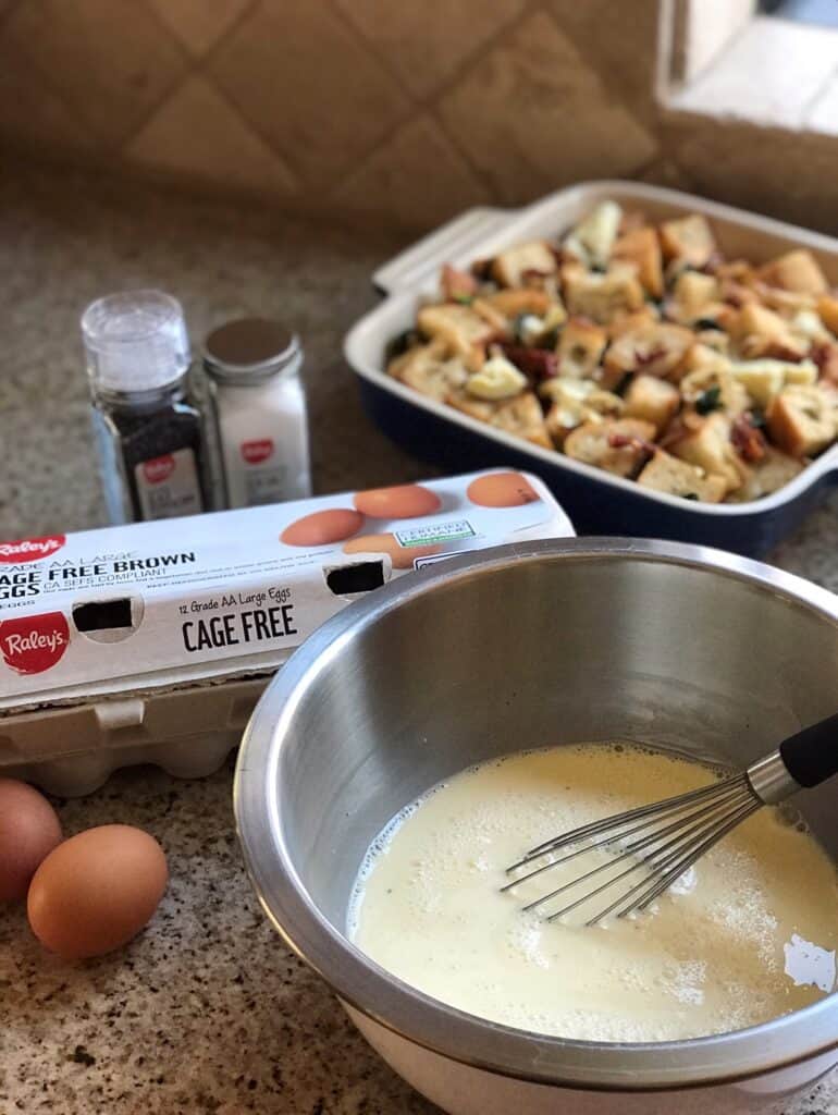 Shot of a carton of eggs, whisked eggs, and dry strata mix