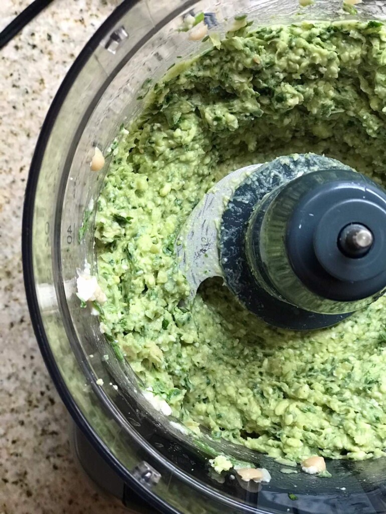 Overhead shot of Spinach & Feta White Bean Dip blended in a food processor 