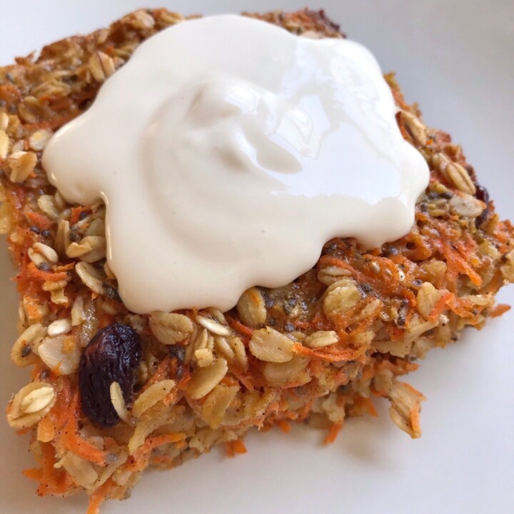 Close-up shot of slice of Carrot Cake Baked Oatmeal with cream cheese frosting