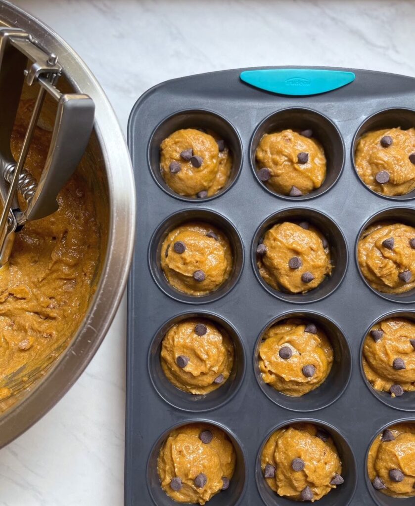 Overhead shot of Whole Grain Pumpkin Muffins in a tray before baking 