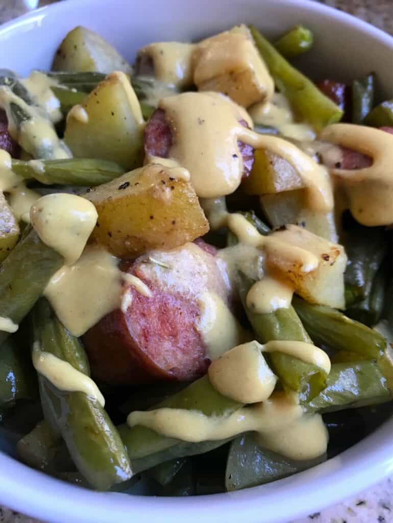 Close-up shot of a bowl of One-Pan Kielbasa Veggie Bake